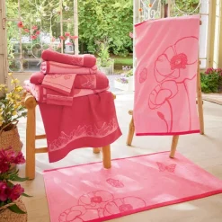 Couché dans les fleurs  2 gants de toilette
