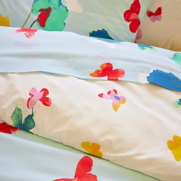 Couché dans les fleurs Housse de couette
