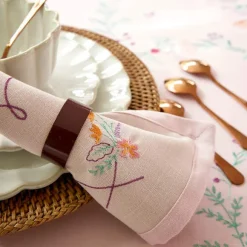 Les colliers de fleurs  Serviettes de table